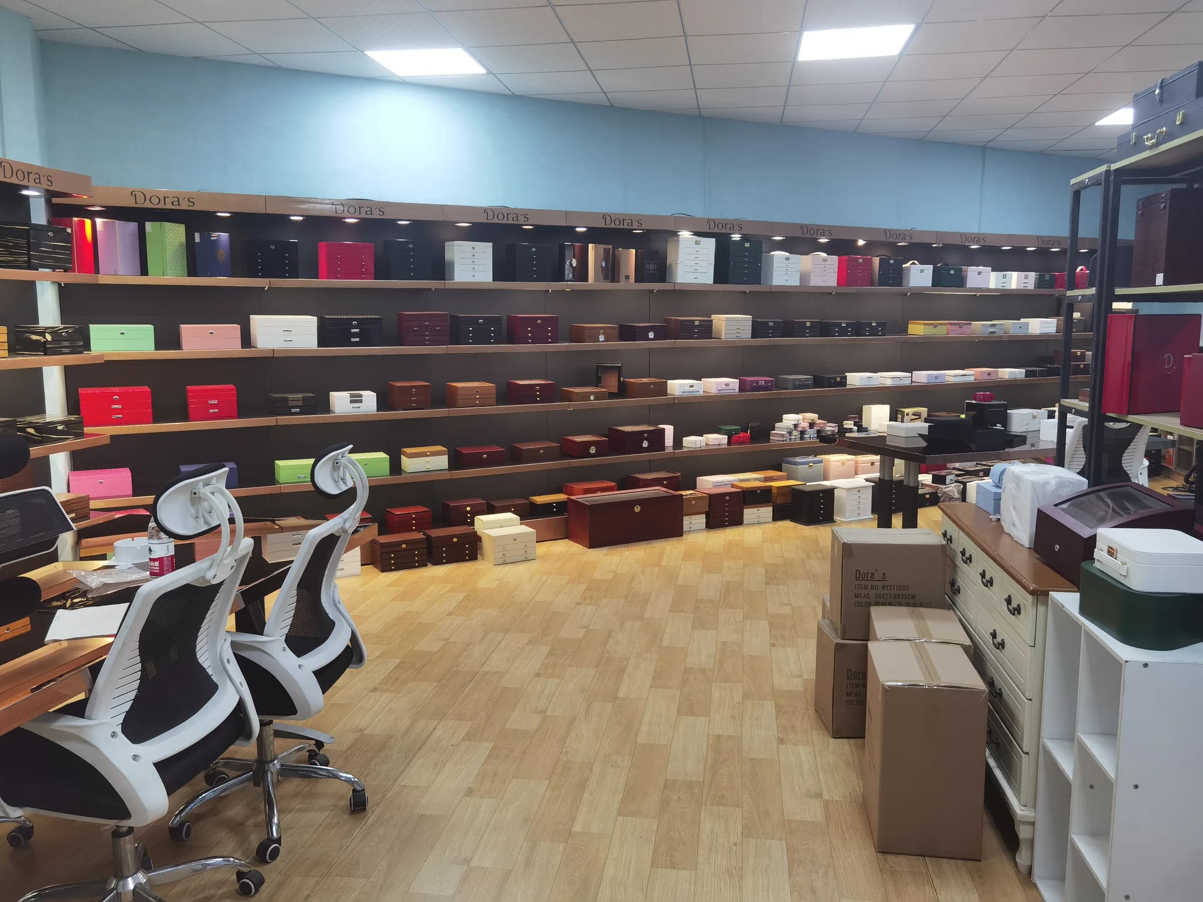 Shelves displaying jewelry storage boxes in different sizes, colors and finishes