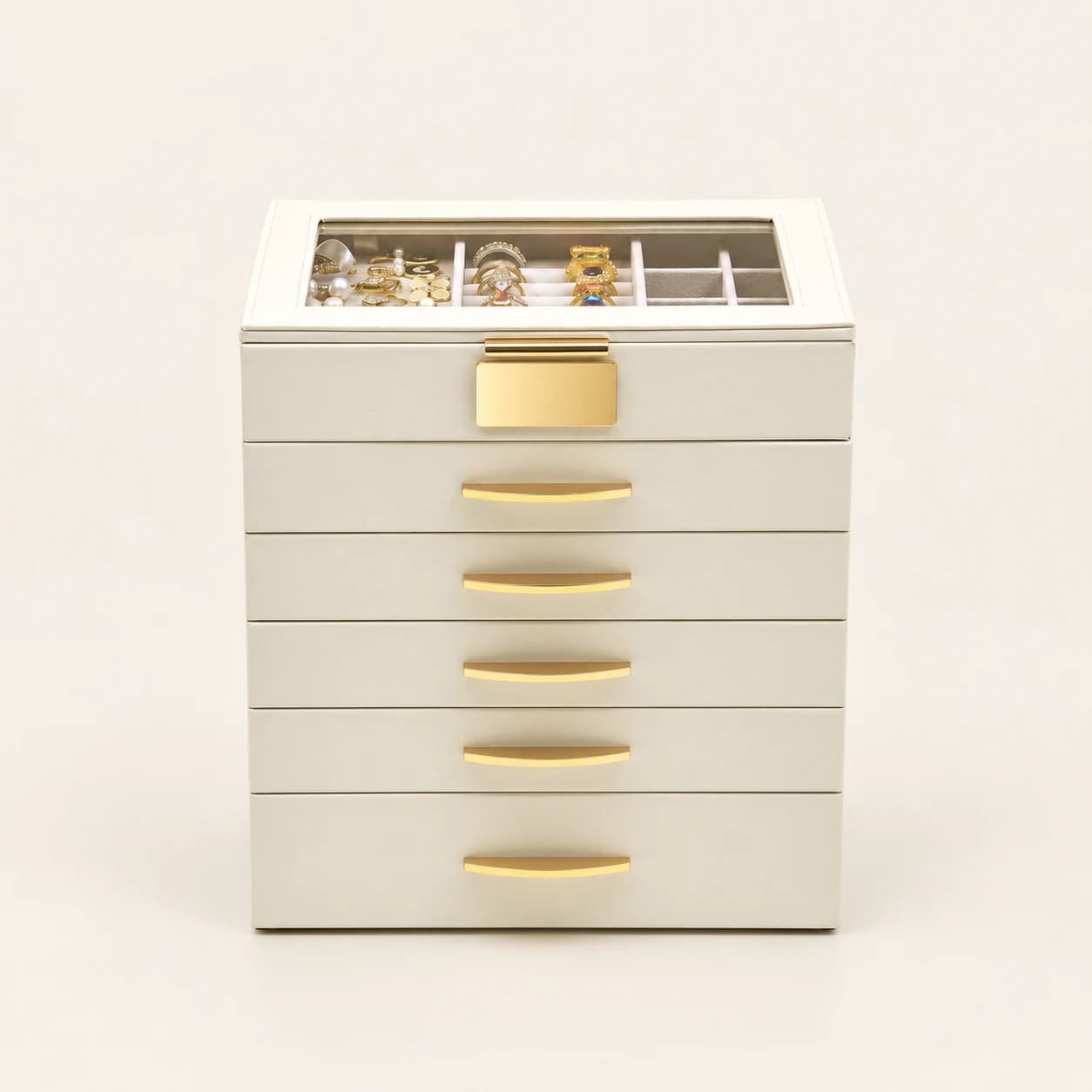 White five-drawer jewelry organizer with a transparent lid and gold-tone handles